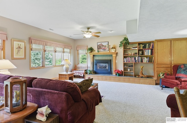 11402 Todd Dr, Blair, NE 68008 - carpeted living room with a tile fireplace and a ceiling fan