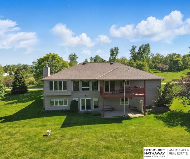 11402 Todd Dr, Blair, NE 68008 - back of property with a chimney, a patio area, a yard, and a deck
