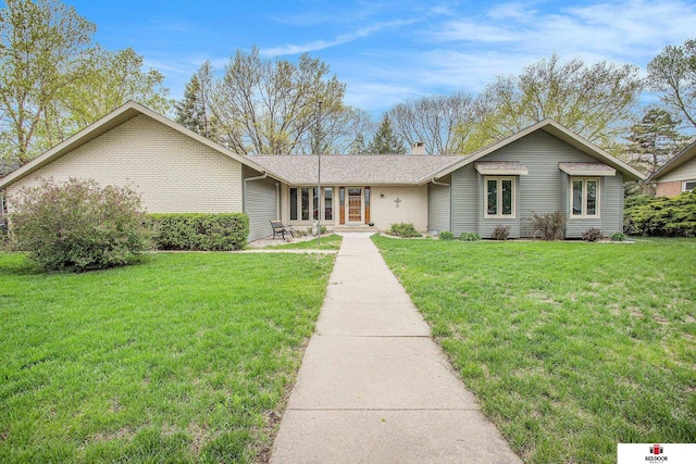 1521 Kingston Rd, Lincoln, NE 68506 - ranch-style home with a chimney, brick siding, and a front yard
