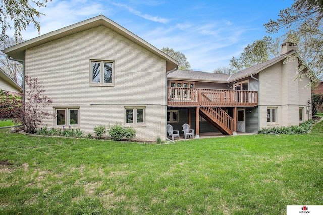 1521 Kingston Rd, Lincoln, NE 68506 - rear view of property featuring a lawn, a wooden deck, stairs, and brick siding
