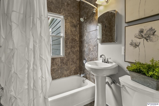 full bathroom with toilet and shower / tub combo with curtain