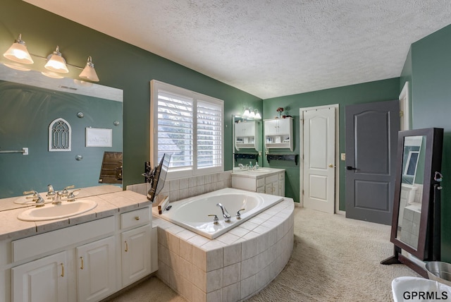 18063 Jones St, Elkhorn, NE 68022 - bathroom with a textured ceiling, two vanities, a sink, and a bath