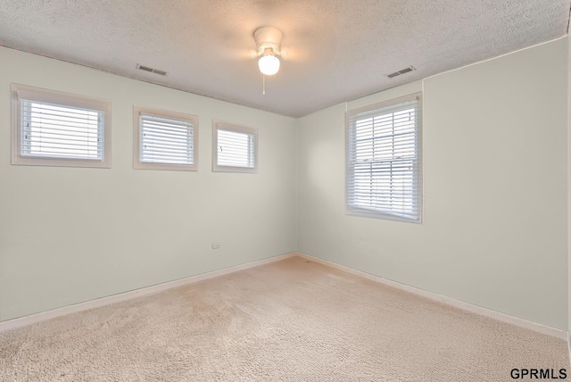18063 Jones St, Elkhorn, NE 68022 - empty room with carpet, a textured ceiling, and visible vents
