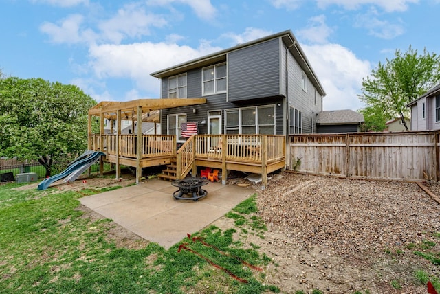 18063 Jones St, Elkhorn, NE 68022 - rear view of property featuring fence, a patio, an outdoor fire pit, and a deck