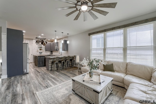 18063 Jones St, Elkhorn, NE 68022 - living room with ceiling fan, recessed lighting, and light wood-style flooring