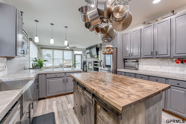 18063 Jones St, Elkhorn, NE 68022 - kitchen with stainless steel refrigerator with ice dispenser, wood counters, gray cabinetry, and a ceiling fan