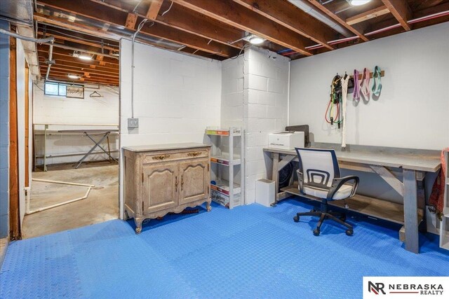 office area with concrete block wall