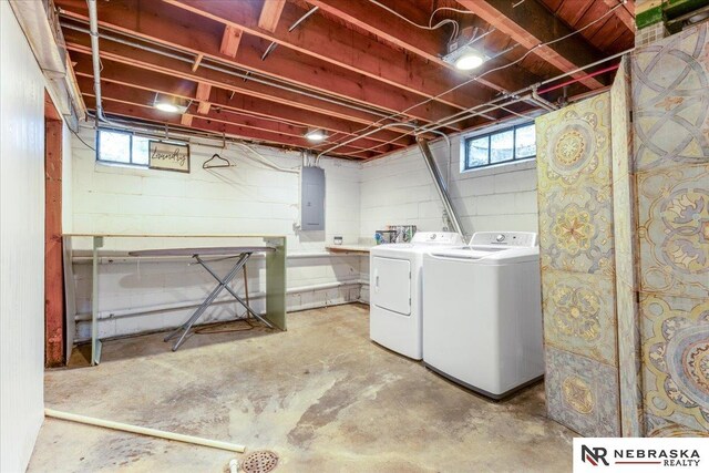 laundry area featuring laundry area, independent washer and dryer, and electric panel