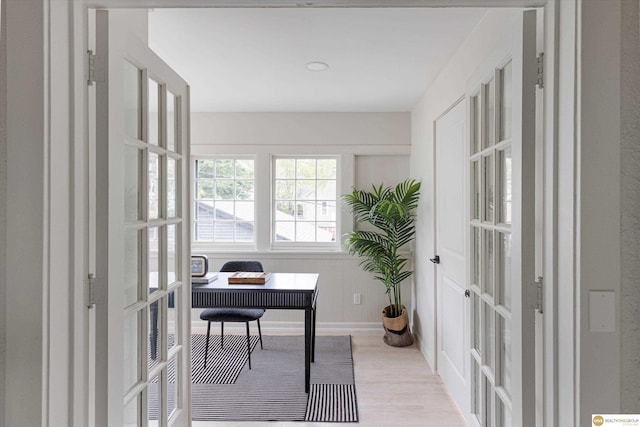 home office with french doors and wood finished floors