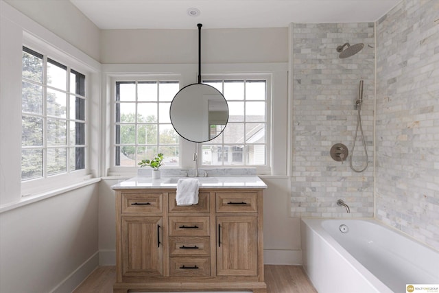 full bath with vanity, shower / bathing tub combination, and wood finished floors