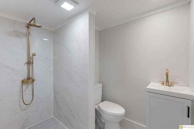 bathroom with a marble finish shower, vanity, and toilet