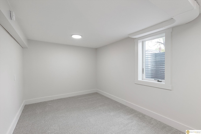 below grade area with carpet floors and baseboards