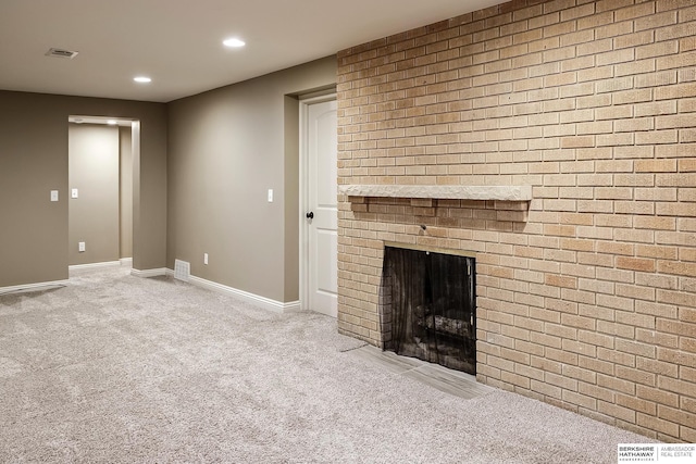 unfurnished living room featuring carpet flooring, a fireplace, recessed lighting, and baseboards