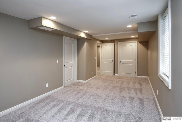basement featuring carpet, baseboards, and recessed lighting