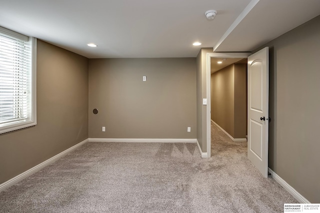 below grade area with carpet floors, baseboards, and recessed lighting