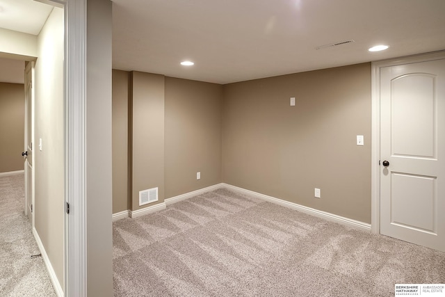 finished below grade area with carpet, visible vents, and recessed lighting