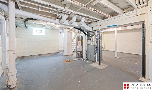 basement with water heater and heating unit
