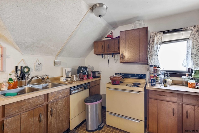 405 N 25th St, Lincoln, NE 68503 - kitchen with white electric stove, dishwasher, a sink, light countertops, and lofted ceiling