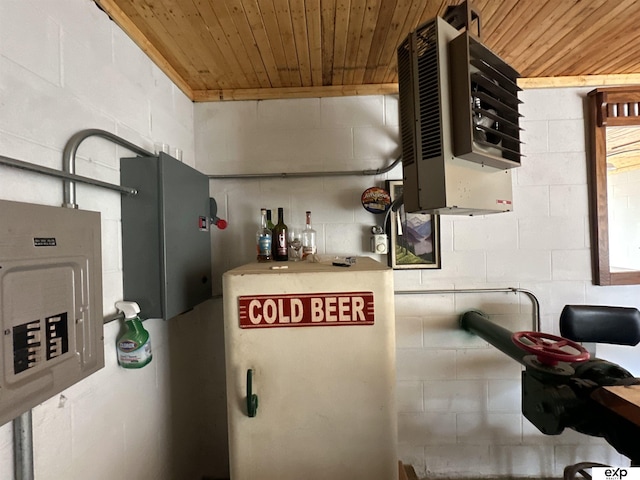utility room with a heating unit and electric panel