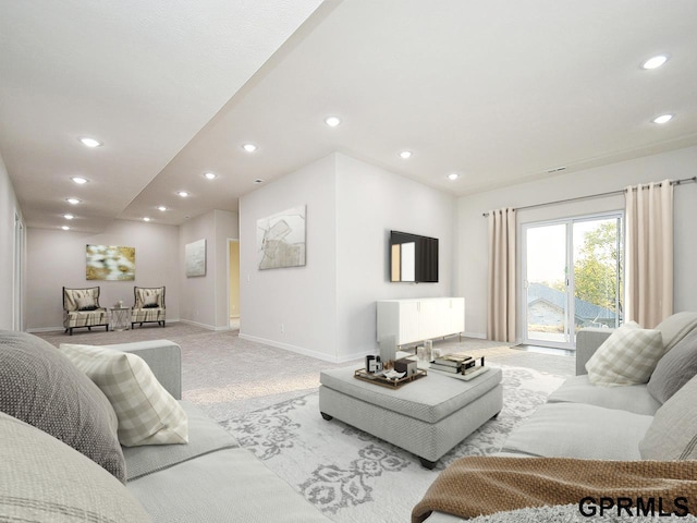 living room with light colored carpet, recessed lighting, and baseboards