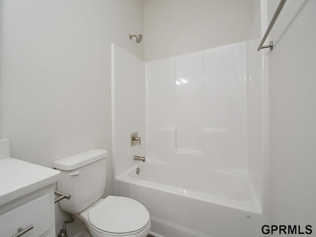 full bath with vanity, bathtub / shower combination, and toilet
