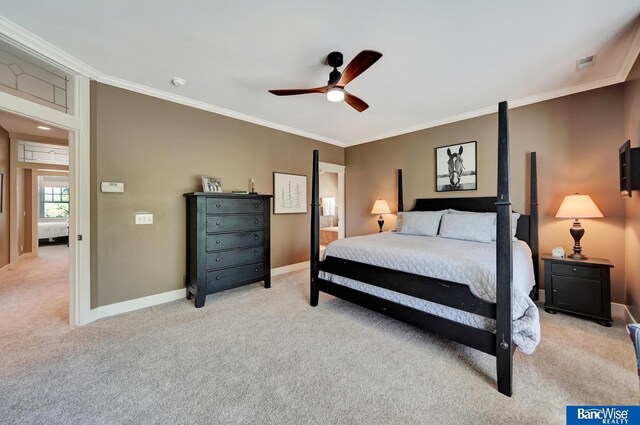 bedroom featuring light carpet, ornamental molding, baseboards, and ceiling fan