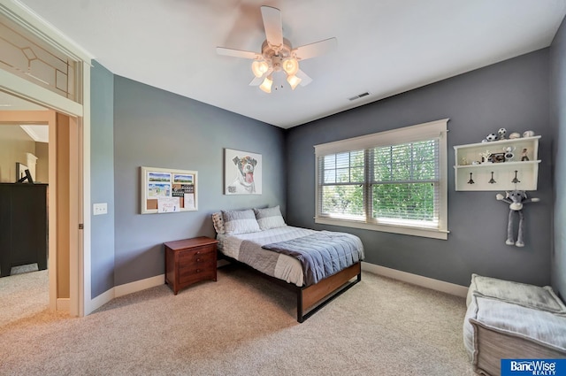bedroom featuring carpet, baseboards, and ceiling fan