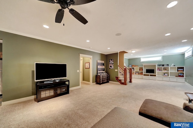 living area featuring carpet flooring, stairs, recessed lighting, crown molding, and ceiling fan