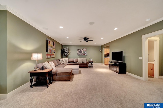 carpeted living area with recessed lighting, baseboards, a ceiling fan, and ornamental molding