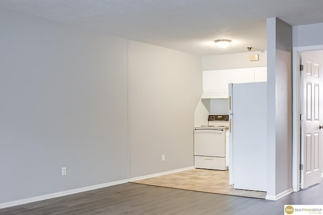 interior space featuring light wood-style floors and baseboards