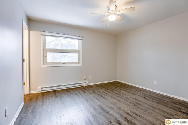 empty room with a ceiling fan, baseboards, wood finished floors, and a baseboard radiator