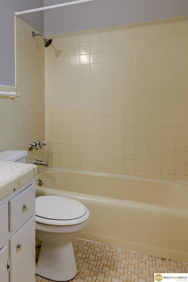 full bath with vanity, shower / bathing tub combination, tile patterned floors, and toilet