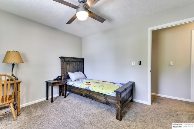 bedroom with carpet flooring, a ceiling fan, and baseboards