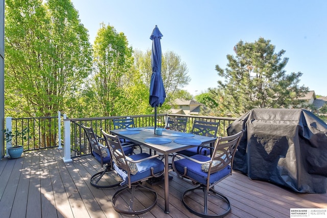wooden terrace featuring outdoor dining space