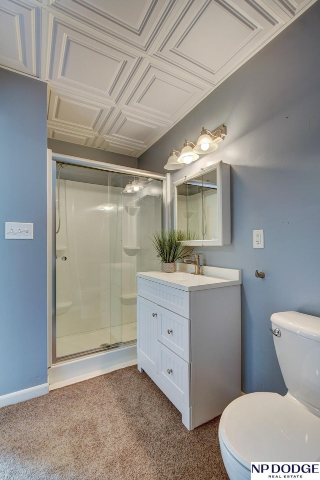 bathroom with vanity, carpet floors, a stall shower, and toilet