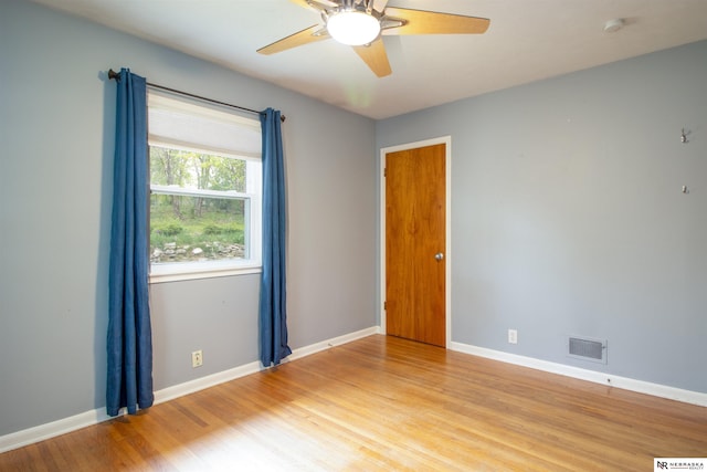8514 Pinkney St, Omaha, NE 68134 - unfurnished room featuring ceiling fan, visible vents, baseboards, and light wood-type flooring