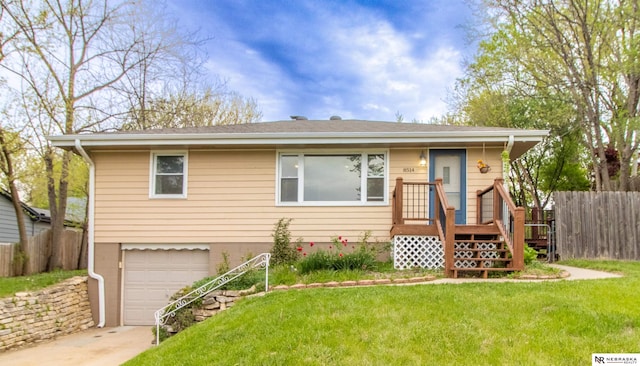 8514 Pinkney St, Omaha, NE 68134 - bungalow featuring an attached garage, fence, driveway, and a front yard