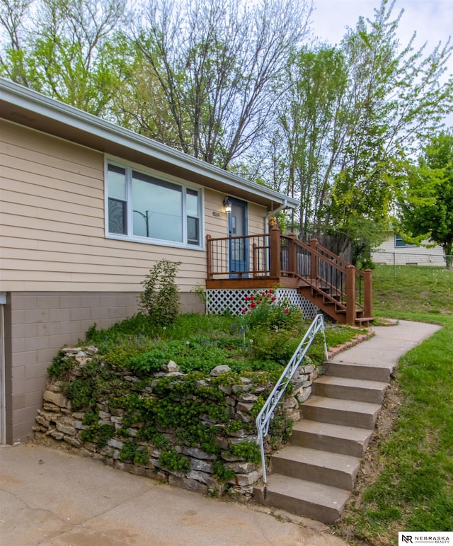8514 Pinkney St, Omaha, NE 68134 - view of front of property with stairs and a wooden deck
