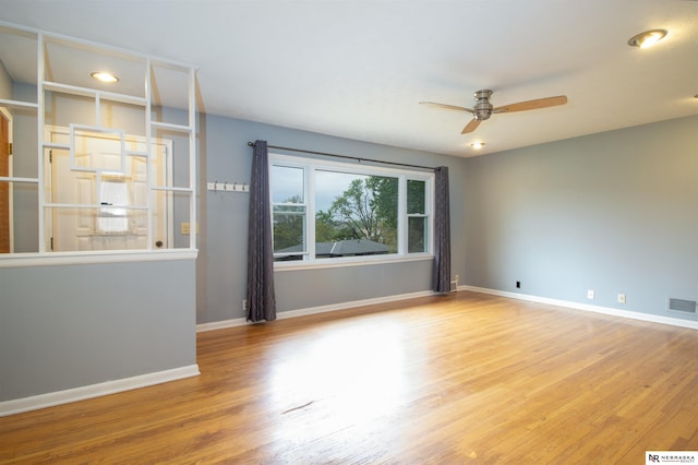 8514 Pinkney St, Omaha, NE 68134 - unfurnished room featuring baseboards, a ceiling fan, and wood finished floors