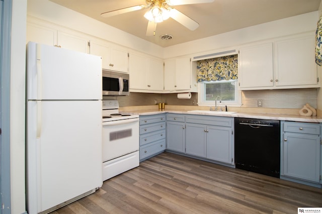 8514 Pinkney St, Omaha, NE 68134 - kitchen with a sink, light countertops, decorative backsplash, and white appliances