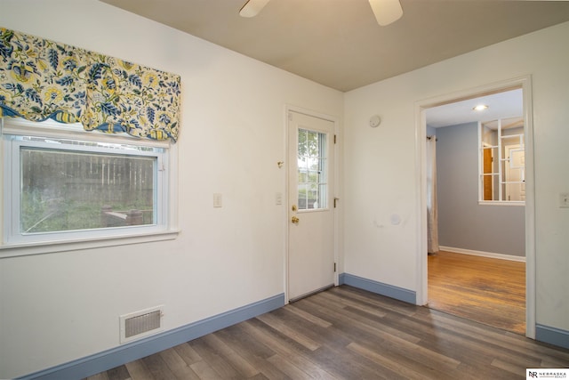 8514 Pinkney St, Omaha, NE 68134 - entrance foyer with a ceiling fan, baseboards, visible vents, and dark wood-style floors