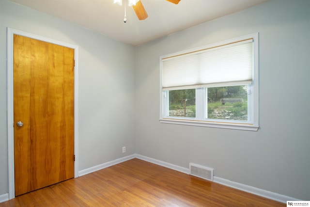 8514 Pinkney St, Omaha, NE 68134 - unfurnished room featuring visible vents, a ceiling fan, baseboards, and wood finished floors