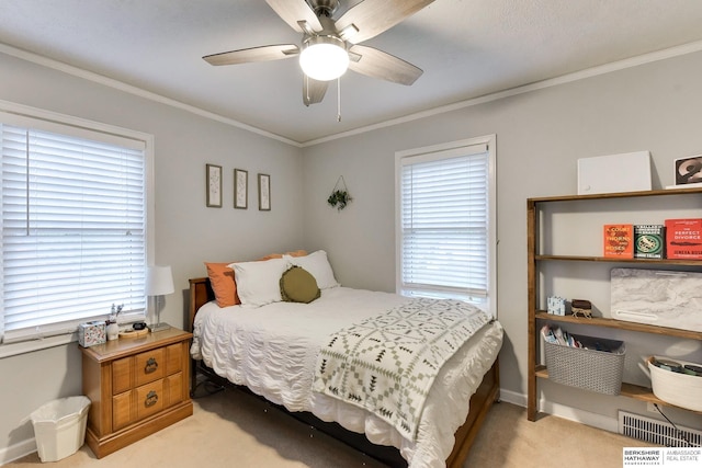 bedroom with light colored carpet, visible vents, multiple windows, and ornamental molding