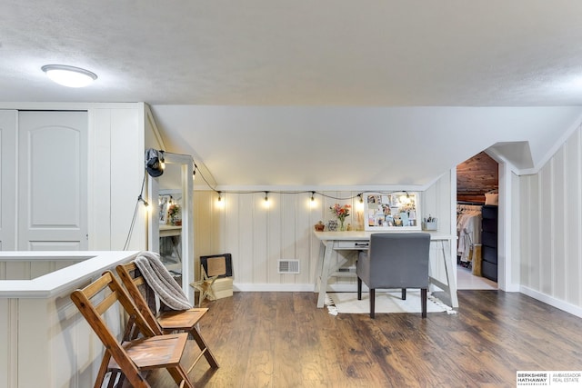 sitting room featuring baseboards, visible vents, and wood finished floors