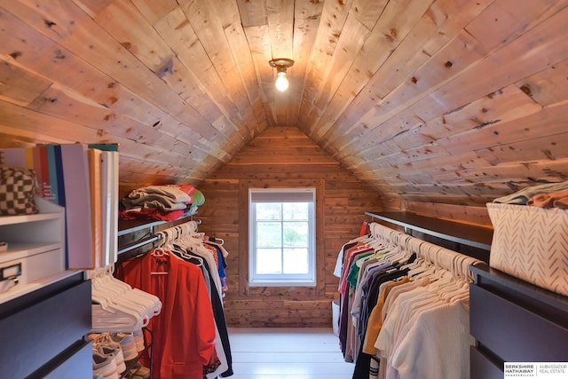 walk in closet featuring lofted ceiling