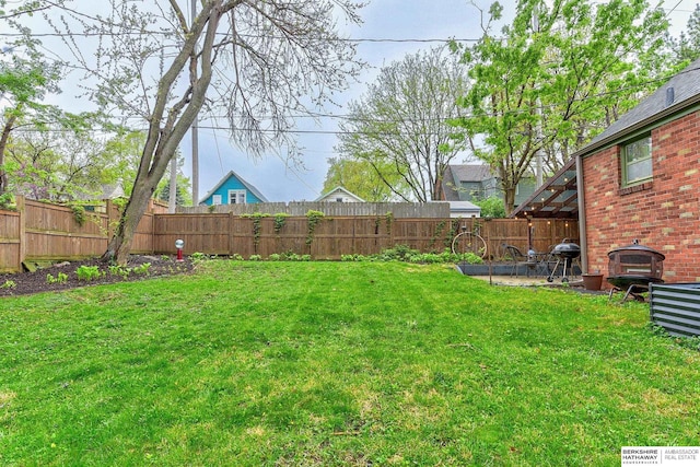 view of yard with a fenced backyard