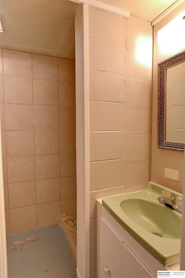 bathroom featuring a stall shower and vanity
