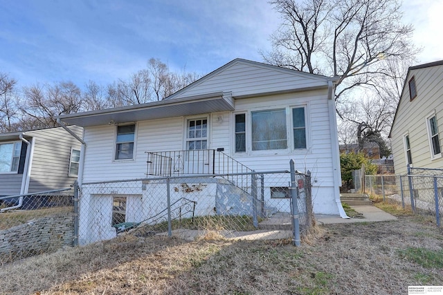 bungalow-style house with a fenced front yard