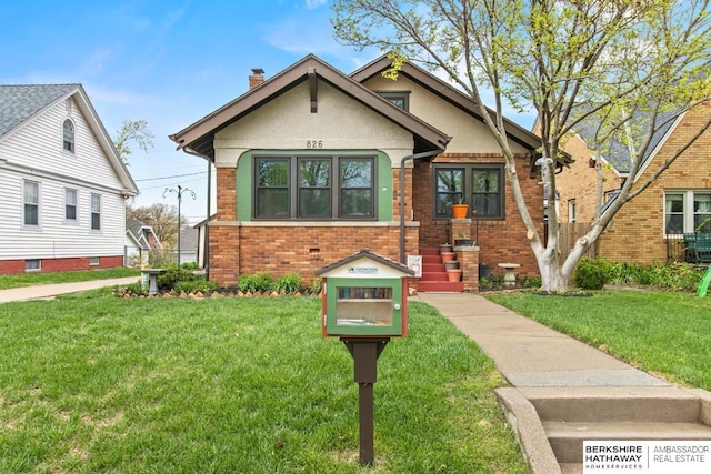 bungalow-style house with brick siding, a front lawn, stucco siding, and a chimney