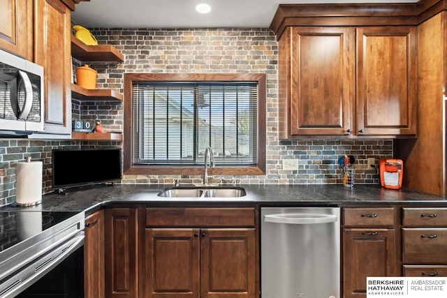kitchen with dark countertops, open shelves, a sink, stainless steel appliances, and tasteful backsplash